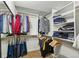 Organized walk-in closet features ample hanging space and shelving for clothes and accessories at 1438 N Franklin St # 100, Denver, CO 80218