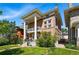 Brick home with prominent columns, a second-story balcony, and well-maintained landscaping at 1438 N Franklin St # 100, Denver, CO 80218