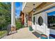 Charming front porch featuring a unique oval-windowed door and decorative details at 1438 N Franklin St # 100, Denver, CO 80218