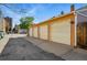 Four-car garage with alley access and concrete driveway in a residential neighborhood at 1438 N Franklin St # 100, Denver, CO 80218
