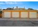Four-car garage with alley access and concrete driveway in a residential neighborhood at 1438 N Franklin St # 100, Denver, CO 80218