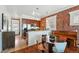 Eat-in kitchen boasts stainless steel appliances, granite countertops, and brick accent wall at 1438 N Franklin St # 100, Denver, CO 80218