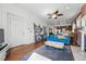 Open-concept living room with exposed brick and hardwood floors, offering a cozy and inviting atmosphere at 1438 N Franklin St # 100, Denver, CO 80218