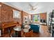 Charming living room features exposed brick, a fireplace, and an open layout at 1438 N Franklin St # 100, Denver, CO 80218