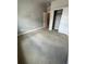 Neutral bedroom with closet and door leading to other rooms in the house at 16841 Askins Loop # 208, Parker, CO 80134