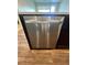 Stainless steel dishwasher seamlessly integrated into the kitchen island for convenience at 16841 Askins Loop # 208, Parker, CO 80134