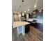 Well-equipped kitchen featuring a central island, stainless steel appliances, and ample counter space at 16841 Askins Loop # 208, Parker, CO 80134