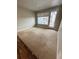 Spacious living room with access to a private balcony offering natural light and outdoor views at 16841 Askins Loop # 208, Parker, CO 80134
