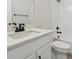 Small bathroom with white vanity and bathtub at 9204 Truckee Ct, Commerce City, CO 80022