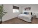 Bright bedroom with large window, plush carpet, and cozy bedding at 3355 S Flower St # 95, Lakewood, CO 80227