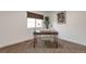 Bright home office featuring a modern desk, chair, and window offering natural light and creating an inviting workspace at 3355 S Flower St # 95, Lakewood, CO 80227
