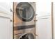 Modern laundry area with stacked washer and dryer, offering convenience and efficiency in a compact space at 3355 S Flower St # 95, Lakewood, CO 80227