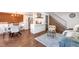Open-concept living room and kitchen with modern finishes and abundant natural light at 3355 S Flower St # 95, Lakewood, CO 80227