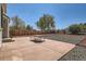 Backyard with patio and picnic table bordered by mulch and gravel at 20336 E 48Th Dr, Denver, CO 80249