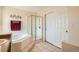 Bathroom featuring a tub with tile surround, a glass enclosed shower and a closet at 20336 E 48Th Dr, Denver, CO 80249