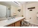 Bathroom featuring a single sink and shower with a tile floor at 20336 E 48Th Dr, Denver, CO 80249