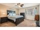 Serene bedroom with a large bed and plenty of natural light at 20336 E 48Th Dr, Denver, CO 80249