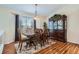 Cozy dining area with beautiful hardwood floors and a classic china cabinet at 20336 E 48Th Dr, Denver, CO 80249