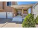Exterior front entrance of the home with a covered front porch at 20336 E 48Th Dr, Denver, CO 80249