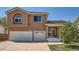 Charming two-story home with a two-car garage and inviting front porch at 20336 E 48Th Dr, Denver, CO 80249