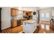 Bright kitchen features granite countertops, stainless steel appliances, and wood cabinets at 20336 E 48Th Dr, Denver, CO 80249