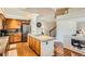 Well-lit kitchen with stainless steel appliances and a convenient island at 20336 E 48Th Dr, Denver, CO 80249