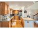 Bright kitchen with wood cabinets, stainless steel appliances, and stone countertops at 20336 E 48Th Dr, Denver, CO 80249