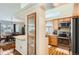 Kitchen with wood cabinets and stainless steel appliances, including view of the dining room at 20336 E 48Th Dr, Denver, CO 80249