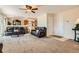 View of the living room with two sofas and an entry to the kitchen at 20336 E 48Th Dr, Denver, CO 80249