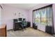 Office with purple walls featuring a computer desk and a window at 20336 E 48Th Dr, Denver, CO 80249