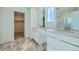 Elegant bathroom with marble floors, dual vanity, and walk-in closet at 5546 Inland Ave, Firestone, CO 80504