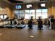 Well-equipped fitness center featuring treadmills, ellipticals, and weight machines, with multiple TVs at 5546 Inland Ave, Firestone, CO 80504