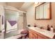 Cozy bathroom featuring a shower, vanity with a sink, and neutral decor at 18150 Martingale Rd, Monument, CO 80132