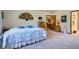 Bright bedroom with a large bed, wood dresser, and stylish decor elements at 18150 Martingale Rd, Monument, CO 80132