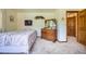 Comfortable bedroom with wood dresser and decor accents, creating a relaxing atmosphere at 18150 Martingale Rd, Monument, CO 80132