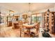 Inviting dining area with hardwood floors and sliding door access to the deck at 18150 Martingale Rd, Monument, CO 80132