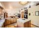Open kitchen layout with light wood cabinets, tile countertops, and island seating at 18150 Martingale Rd, Monument, CO 80132