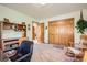 Bright office area with wood furnishings, a closet, and a comfortable rocking chair at 18150 Martingale Rd, Monument, CO 80132