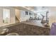 Finished basement featuring home gym equipment and a spacious layout for recreation at 14223 Piney River Rd, Broomfield, CO 80023