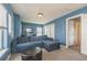 Comfortable bedroom with blue walls, cozy seating, and closet space for a relaxing retreat at 14223 Piney River Rd, Broomfield, CO 80023