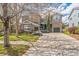 Charming two-story home with a stone facade and a spacious driveway, complemented by green landscaping at 14223 Piney River Rd, Broomfield, CO 80023