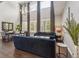 Bright living room with high ceilings, large windows, and stylish furniture, creating an elegant space at 14223 Piney River Rd, Broomfield, CO 80023