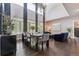 Bright living room with high ceilings, large windows, and stylish furniture, creating an elegant space at 14223 Piney River Rd, Broomfield, CO 80023