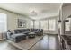 Spacious living room with large windows, fireplace, neutral color palette and an abundance of natural light at 14223 Piney River Rd, Broomfield, CO 80023