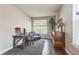 Cozy home office with a desk, seating area, and natural light for a productive workspace at 14223 Piney River Rd, Broomfield, CO 80023