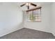 Bedroom featuring neutral walls, carpet, ceiling fan, and a window with wood blinds at 2705 S Danube Way # 110, Aurora, CO 80013
