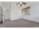 Bedroom featuring neutral walls, carpet, ceiling fan, and a window with wood blinds at 2705 S Danube Way # 110, Aurora, CO 80013
