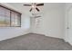 Bedroom featuring neutral walls, carpet, ceiling fan, and a window with wood blinds at 2705 S Danube Way # 110, Aurora, CO 80013