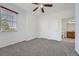 Bedroom featuring neutral walls, carpet, ceiling fan, and an ensuite bathroom at 2705 S Danube Way # 110, Aurora, CO 80013