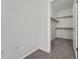 Walk-in closet featuring carpeted floors and adjustable shelving at 2705 S Danube Way # 110, Aurora, CO 80013